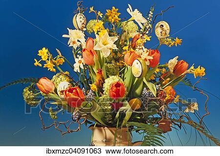 Easter bouquet in a vase against blue View Large Photo Image Stock Image - Easter bouquet in a vase against blue. Fotosearch