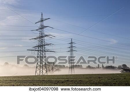Electrical towers and power lines in the morning fog, Bochum-Werne, Bochum, North Rhine-Westphalia, Germany, Europe View Large Photo Image Stock Photo - Electrical towers and power lines in the morning fog, Bochum-Werne, Bochum, North Rhine-Westphalia, Germany, Europe. Fotosearch