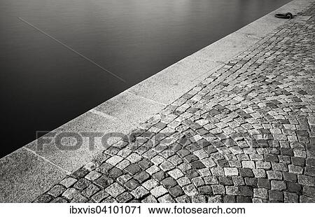 Stock Image - Empty dock with cobblestones in Stockholm, Sweden, Europe. Fotosearch