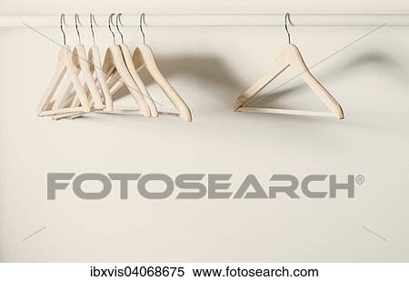 Stock Photography - Empty hangers on a clothes rack. Fotosearch