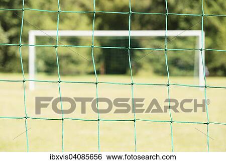 Empty soccer field seen through the net of the goal, Sweden, Europe View Large Photo Image Stock Photograph - Empty soccer field seen through the net of the goal, Sweden, Europe. Fotosearch