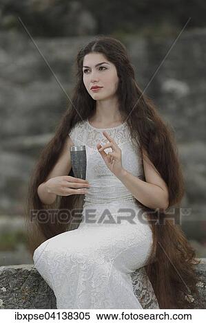 Enactment of the painting The Damsel of the Sanct Grael, The Damsel of the Holy Grail by Dante Gabriel Rossetti, young woman in a white dress with a chalice View Large Photo Image Stock Photography - Enactment of the painting The Damsel of the Sanct Grael, The Damsel of the Holy Grail by Dante Gabriel Rossetti, young woman in a white dress with a chalice. Fotosearch