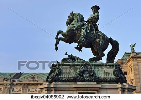Stock Image - Equestrian statue of Prince Eugene in front of Hofburg Palace at Heldenplatz square, Innere Stadt district, Vienna, Austria, Europe. Fotosearch