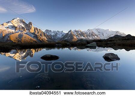 Evening light at Lac de Chesserys with mountains behind of Chamonix, Alps, France, Europe View Large Photo Image Stock Image - Evening light at Lac de Chesserys with mountains behind of Chamonix, Alps, France, Europe. Fotosearch