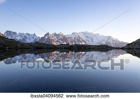 Evening light at Lac de Chesserys with mountains behind of Chamonix, Alps, France, Europe View Large Photo Image Stock Image - Evening light at Lac de Chesserys with mountains behind of Chamonix, Alps, France, Europe. Fotosearch