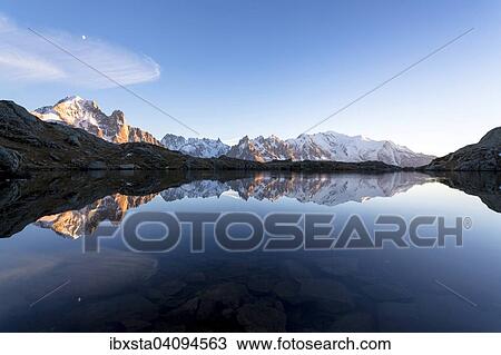 Evening light at Lac de Chesserys with mountains behind of Chamonix, Alps, France, Europe View Large Photo Image Stock Image - Evening light at Lac de Chesserys with mountains behind of Chamonix, Alps, France, Europe. Fotosearch