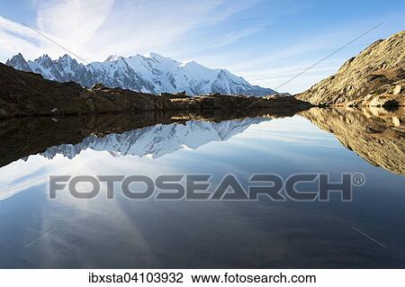 Evening light at Lac de Chesserys with mountains behind of Chamonix, Alps, France, Europe View Large Photo Image Stock Image - Evening light at Lac de Chesserys with mountains behind of Chamonix, Alps, France, Europe. Fotosearch