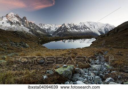Evening light at Lac de Chesserys with mountains behind of Chamonix, Alps, France, Europe View Large Photo Image Stock Photo - Evening light at Lac de Chesserys with mountains behind of Chamonix, Alps, France, Europe. Fotosearch