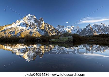 Evening light at Lac de Chesserys with mountains behind of Chamonix, Alps, France, Europe View Large Photo Image Stock Photograph - Evening light at Lac de Chesserys with mountains behind of Chamonix, Alps, France, Europe. Fotosearch