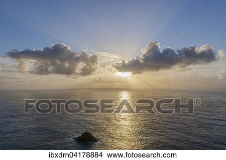 Evening sun behind clouds above the sea, Hermaness, Unst, Shetland Islands, Scotland, United Kingdom, Europe View Large Photo Image Picture - Evening sun behind clouds above the sea, Hermaness, Unst, Shetland Islands, Scotland, United Kingdom, Europe. Fotosearch