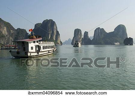 Excursion boat, Halong Bay, Vinh Ha Long, Gulf of Tonkin, Vietnam, Asia View Large Photo Image Picture - Excursion boat, Halong Bay, Vinh Ha Long, Gulf of Tonkin, Vietnam, Asia. Fotosearch
