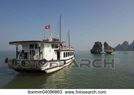 Stock Image - Excursion boat, Halong Bay, Vinh Ha Long, Gulf of Tonkin, Vietnam, Asia. Fotosearch
