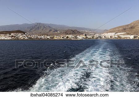 Exit with the ferry from the harbour, Los Cristianos and Mount Teide at the back, Los Cristianos, Tenerife, Canary Islands, Spain, Europe View Large Photo Image Picture - Exit with the ferry from the harbour, Los Cristianos and Mount Teide at the back, Los Cristianos, Tenerife, Canary Islands, Spain, Europe. Fotosearch