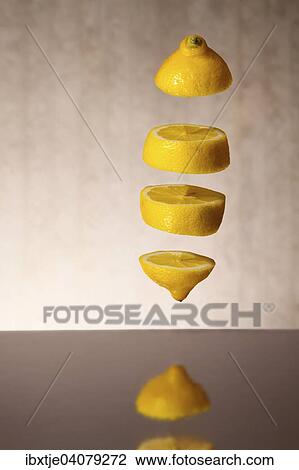 Falling lemon slices View Large Photo Image Stock Image - Falling lemon slices. Fotosearch