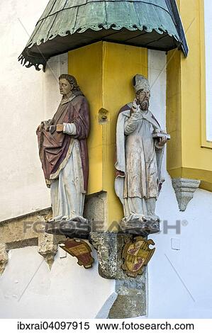 Stock Photography - Figures of St Stephen and St. Nicholas at the Wilder Mann Hotel, Passau Glass Museum, historic centre, Passau, Lower Bavaria, Bavaria, Germany, Europe. Fotosearch