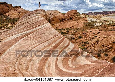 Stock Photo - Fire Wave rock formation, rock formation Sleeping Lizard behind, Valley of Fire State Park, Nevada, USA. Fotosearch