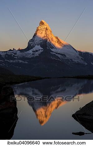 First sunlight on the Matterhorn, with reflection in Stellisee lake, Zermatt, Canton of Valais, Switzerland, Europe View Large Photo Image Stock Image - First sunlight on the Matterhorn, with reflection in Stellisee lake, Zermatt, Canton of Valais, Switzerland, Europe. Fotosearch