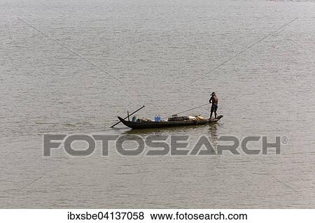 Stock Photo - Fishing boat in the Mekong river, Phnom Penh, Cambodia, Asia. Fotosearch
