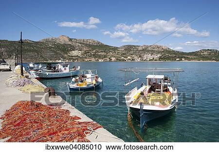Fishing boats in the harbour, Plitra, Peloponnese, Greece, Europe View Large Photo Image Stock Image - Fishing boats in the harbour, Plitra, Peloponnese, Greece, Europe. Fotosearch