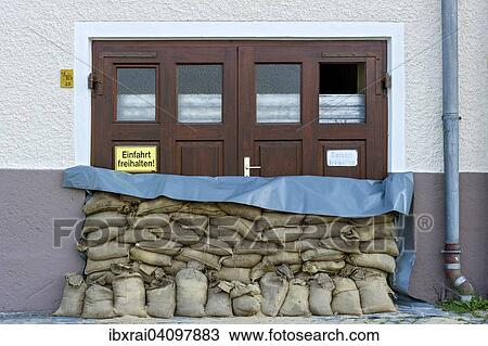 Flood control measures, sandbags and a protective wall of steel slats in front of a garage door, historic centre, Passau, Lower Bavaria, Bavaria, Germany, Europe View Large Photo Image Stock Image - Flood control measures, sandbags and a protective wall of steel slats in front of a garage door, historic centre, Passau, Lower Bavaria, Bavaria, Germany, Europe. Fotosearch