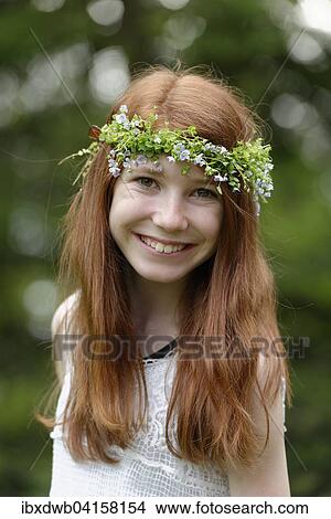 Picture - Flower child, girl with flower wreath in her hair. Fotosearch
