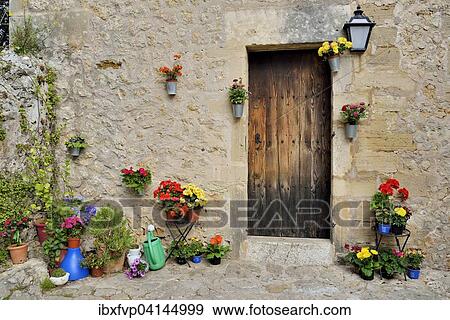 Stock Photo - Flowerpots in front of a house, Pollenca, Majorca, Balearic Islands, Spain, Europe. Fotosearch