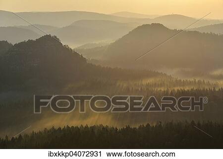 Fog and haze in the morning in the Elbe Sandstone Mountains, Saxon Switzerland, Saxony, Germany, Europe View Large Photo Image Stock Image - Fog and haze in the morning in the Elbe Sandstone Mountains, Saxon Switzerland, Saxony, Germany, Europe. Fotosearch