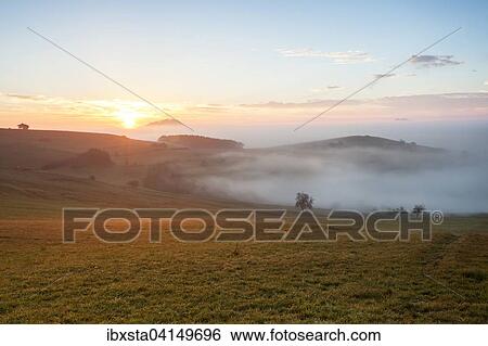 Stock Photograph - Foggy view of Bisberg, Hegau, Baden-Wurttemberg, Germany, Europe. Fotosearch