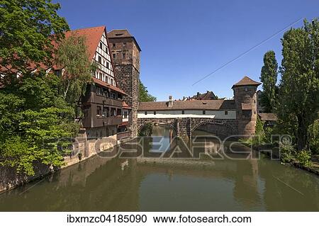 Former Weinstadl, 1446-48 built as a special infirmary, former water tower in middle, former executioner's house right, Maxbrucke left, Pegnitz in front, Nuremberg, Middle Franconia, Bavaria, Germany, Europe View Large Photo Image Stock Image - Former Weinstadl, 1446-48 built as a special infirmary, former water tower in middle, former executioner's house right, Maxbrucke left, Pegnitz in front, Nuremberg, Middle Franconia, Bavaria, Germany, Europe. Fotosearch