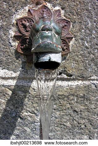 Fountain well gargoyle with an old tap View Large Photo Image Stock Photo - Fountain well gargoyle with an old tap. Fotosearch