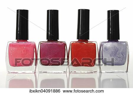 Four nail polish bottles in a row, different colors View Large Photo Image Stock Photograph - Four nail polish bottles in a row, different colors. Fotosearch