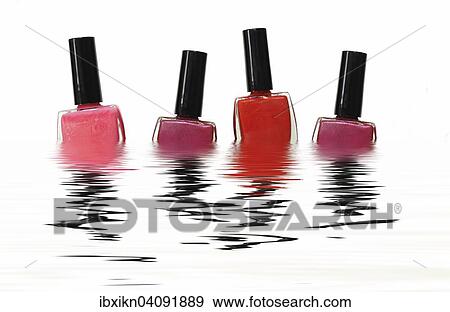 Four nail polish bottles in the water View Large Photo Image Stock Photo - Four nail polish bottles in the water. Fotosearch