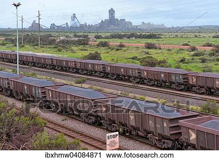 Freight train loaded with iron ore, at the entrance to the ore-loading port, at the back the Saldanha Steel steelworks, Saldanha, Western Cape, South Africa, Africa View Large Photo Image Stock Image - Freight train loaded with iron ore, at the entrance to the ore-loading port, at the back the Saldanha Steel steelworks, Saldanha, Western Cape, South Africa, Africa. Fotosearch