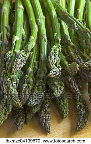 Fresh green asparagus on a wooden board View Large Photo Image Stock Image - Fresh green asparagus on a wooden board. Fotosearch