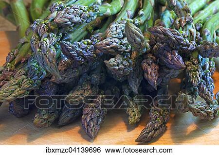 Fresh green asparagus on a wooden board View Large Photo Image Stock Photograph - Fresh green asparagus on a wooden board. Fotosearch
