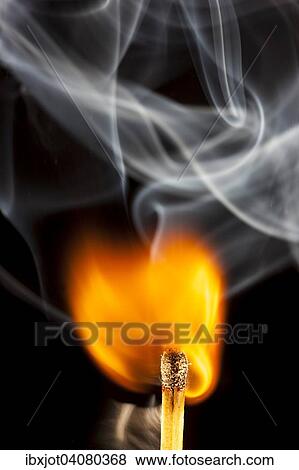 Stock Photo - Freshly ignited match, flame at the match head. Fotosearch