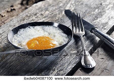 Fried egg, fried in a pan View Large Photo Image Stock Image - Fried egg, fried in a pan. Fotosearch