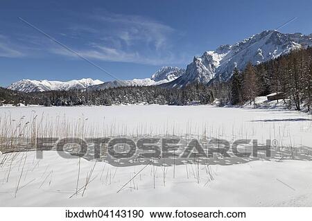 Frozen lake Lautersee in front of Karwendel Mountains, near Mittenwald, Werdenfelser Land, Upper Bavaria, Bavaria, Germany, Europe View Large Photo Image Stock Image - Frozen lake Lautersee in front of Karwendel Mountains, near Mittenwald, Werdenfelser Land, Upper Bavaria, Bavaria, Germany, Europe. Fotosearch