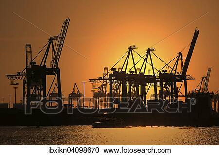 Gantry cranes, harbour cranes, container terminal, sunset, port, Hamburg, Germany, Europe View Large Photo Image Stock Image - Gantry cranes, harbour cranes, container terminal, sunset, port, Hamburg, Germany, Europe. Fotosearch