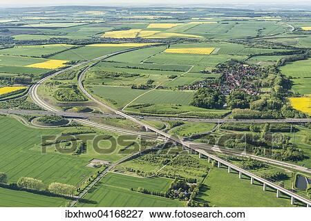 Stock Photo - German federal highways 4 and 71, Erfurter Kreuz interchange, ICE high-speed railway line Berlin-Munich, opened in 2015, part of the transport project Deutsche Einheit, Ichtershausen, Thuringia, Germany, Europe. Fotosearch