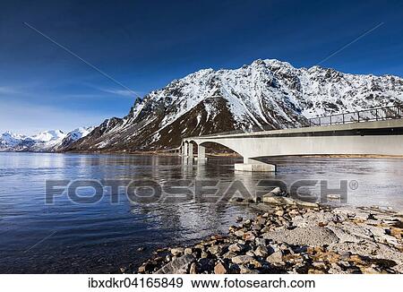 Stock Photo - Gimsoystraumen bridge at night with a starry sky, Gimsoy Bridge, Gimsoy, Lofoten, Norway, Europe. Fotosearch