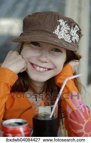 Girl with cap, with drink and straw, Corsica, France, Europe View Large Photo Image Stock Photo - Girl with cap, with drink and straw, Corsica, France, Europe. Fotosearch