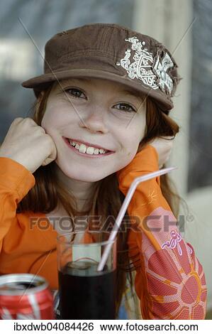 Girl with cap, with drink and straw, Corsica, France, Europe View Large Photo Image Stock Photograph - Girl with cap, with drink and straw, Corsica, France, Europe. Fotosearch