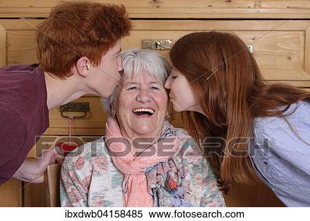 Grandmother getting a kiss from her grandchildren, Bavaria, Germany, Europe View Large Photo Image Stock Photography - Grandmother getting a kiss from her grandchildren, Bavaria, Germany, Europe. Fotosearch