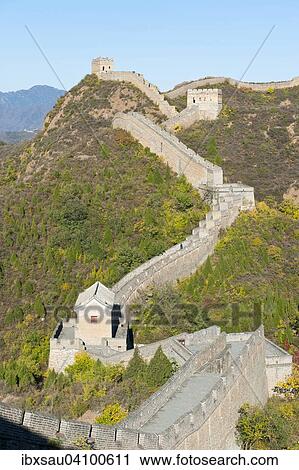 Stock Image - Great Wall of China, historical border fortress, restored section with watchtowers, winding through the mountains, Jinshanling, China, Asia. Fotosearch