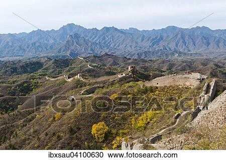 Stock Image - Great Wall of China, historical border fortress, un-restored section, winding through the mountains, autumn, Gubeikou, near Jinshanling, China, Asia. Fotosearch
