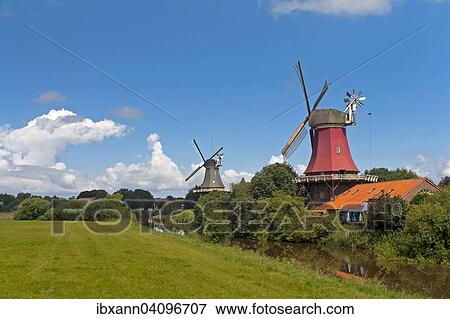 Greetsiel twin windmills, smock mills, Greetsiel, Krummhorn, East Frisia, Lower Saxony, Germany, Europe View Large Photo Image Stock Photo - Greetsiel twin windmills, smock mills, Greetsiel, Krummhorn, East Frisia, Lower Saxony, Germany, Europe. Fotosearch