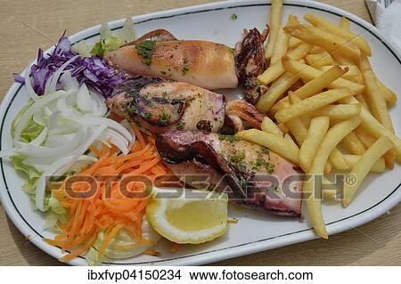 Grilled squid, fries and salad on a plate, Majorca, Balearic Islands, Spain, Europe View Large Photo Image Picture - Grilled squid, fries and salad on a plate, Majorca, Balearic Islands, Spain, Europe. Fotosearch
