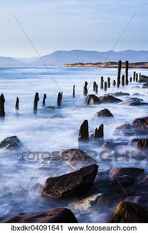 Groynes on Rossbehy Beach, Glenbeigh, County Kerry, Ireland, Europe View Large Photo Image Stock Image - Groynes on Rossbehy Beach, Glenbeigh, County Kerry, Ireland, Europe. Fotosearch