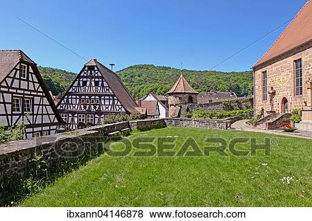 Half-timbered town hall with the facade of the fortified church and cemetery, Dorrenbach, Palatinate, Rhineland-Palatinate, Germany, Europe View Large Photo Image Stock Photo - Half-timbered town hall with the facade of the fortified church and cemetery, Dorrenbach, Palatinate, Rhineland-Palatinate, Germany, Europe. Fotosearch
